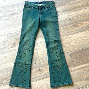 Vintage 90’s jeans flared legs, metal embellishments on the legs. Size 7